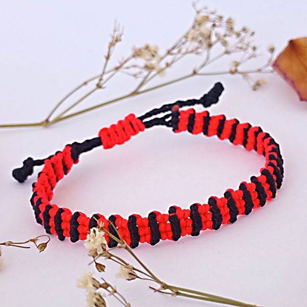 Bracciale ritornello nero e arancione fluorescente